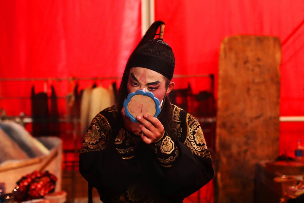 An actor prepares for a performance during the Hungry Ghost Festival in Hong Kong. Photo: Sam Tsang
