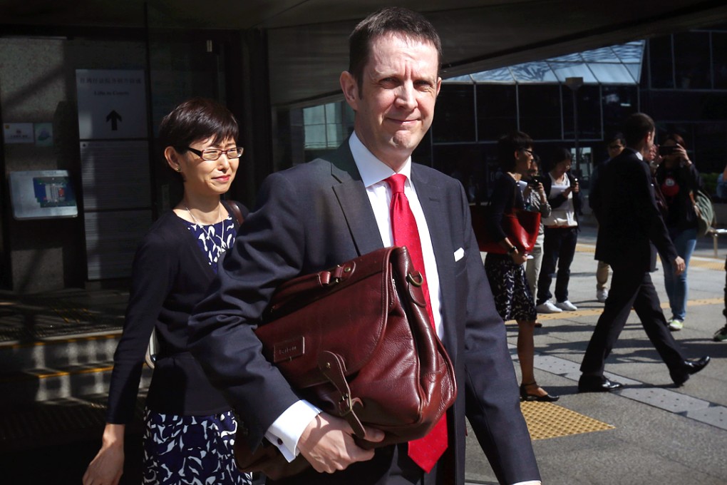 Mark McFarland with his wife Irene Li appears at the Small Claims Tribunal in Wan Chai. Photo: SCMP Pictures