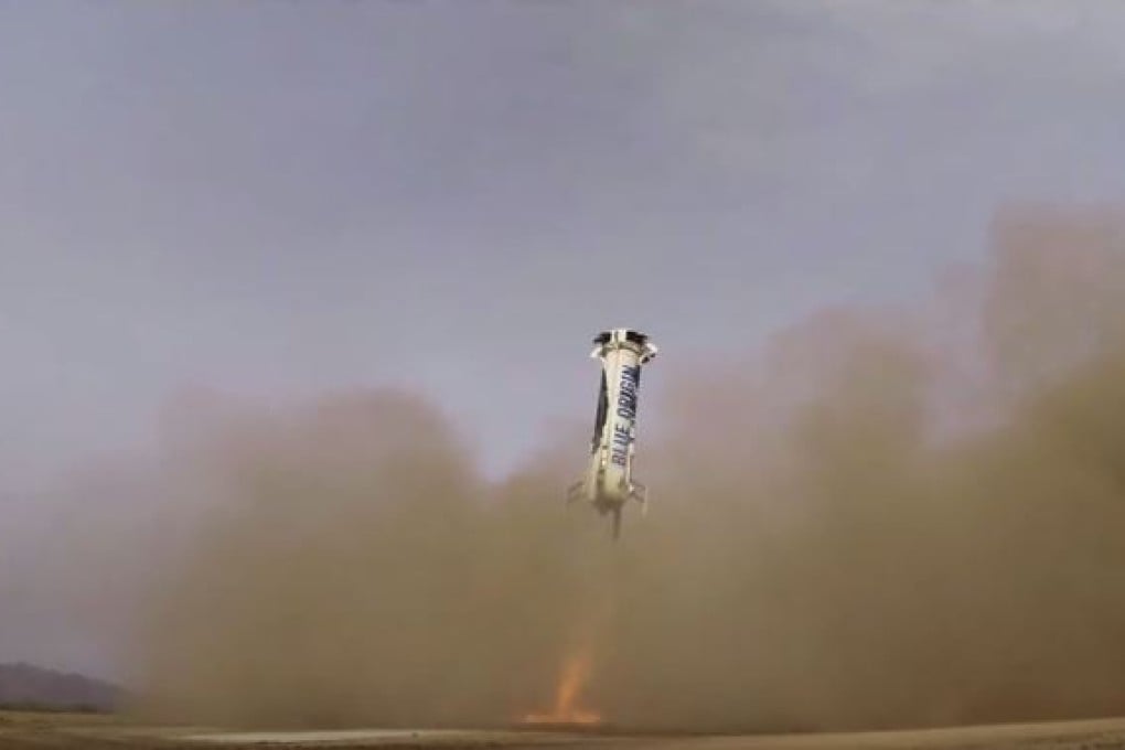 The New Shepard rocket descends at a speed of 7km/h on Monday. It landed just 1.5 metres from the exact spot where it took off. Photo: Blue Origin/YouTube