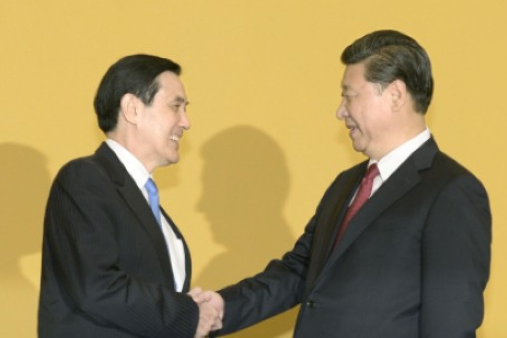 Taiwan's President Ma Ying-jeou and Xi Jinping greet each other at the Singapore summit. Photo: Kyodo