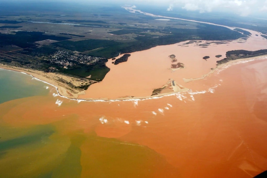 The toxic dam spill has spread along the Rio Dolce.Photo: AFP
