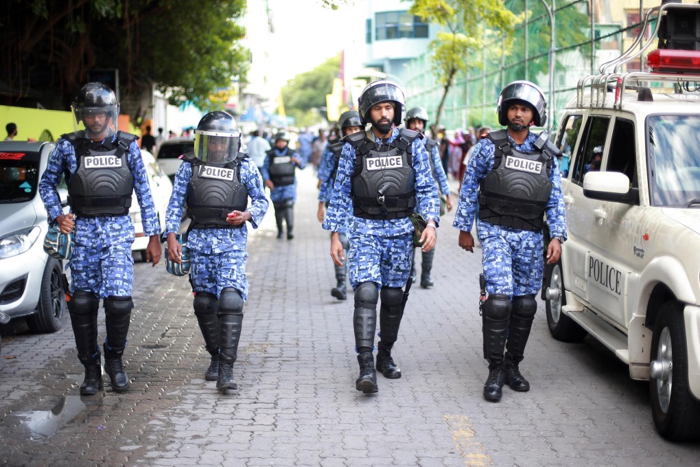 Maldivian police take to the streets to tackle the protest.Photo: AP