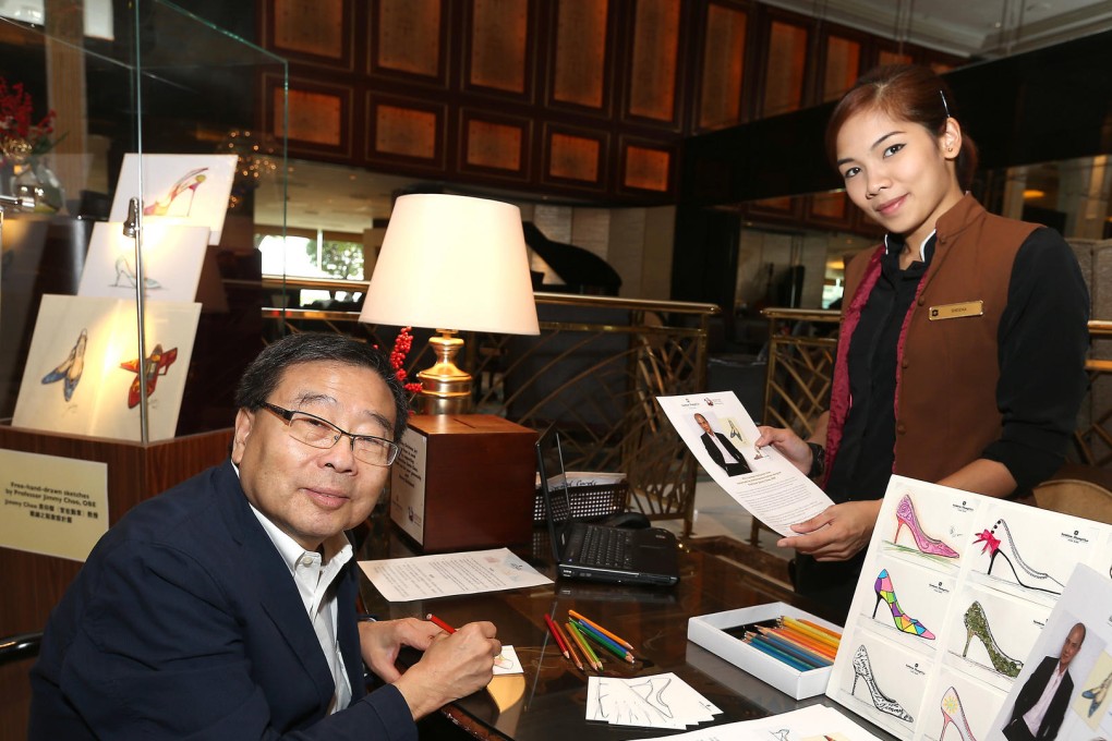 A donor sketches a shoe for Choo's fundraiser. Photo: K. Y. Cheng