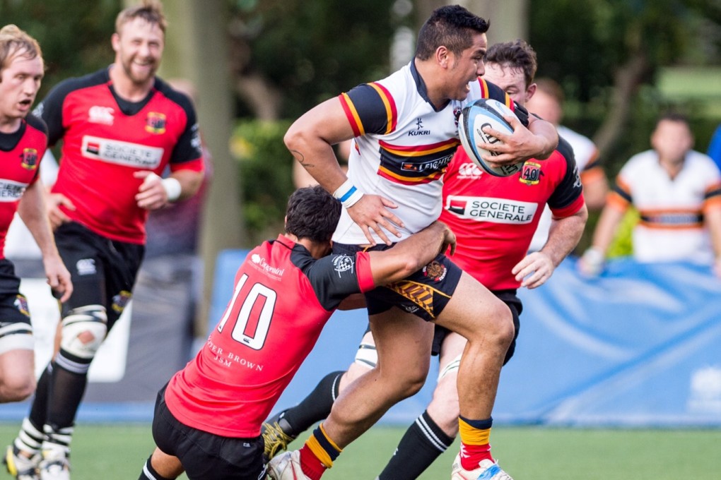 HKCC number eight Marcus Slade is stopped in his tracks by Valley's Ben Rimene when the teams clashed earier this season. Photo: HKRU