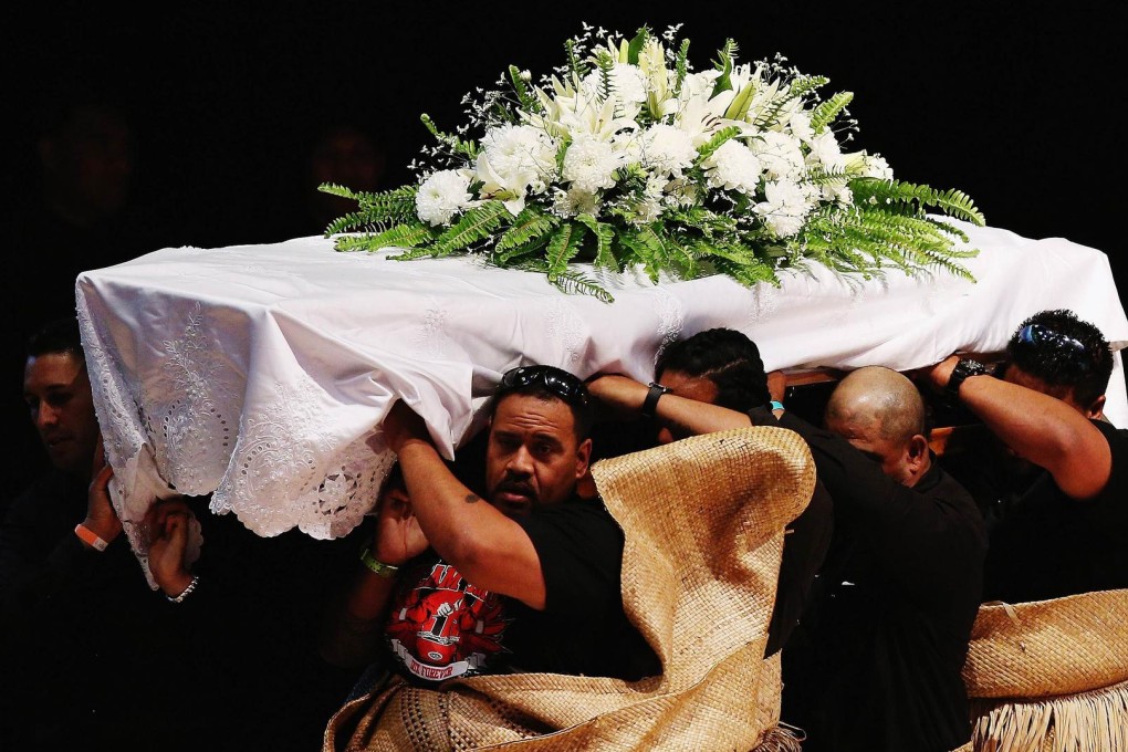 The casket containing Jonah Lomu is carried out. Photos: AFP