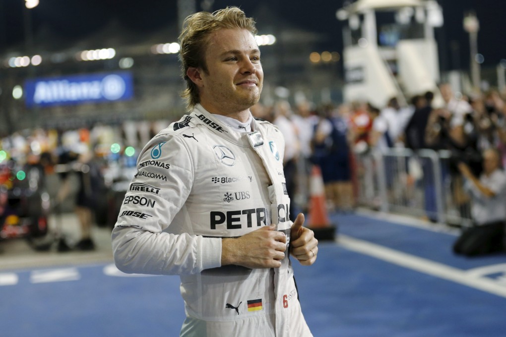 Nico Rosberg of Mercedes runs to his fans after snatching pole position for Sunday's Abu Dhabi Grand Prix. Photo: Reuters