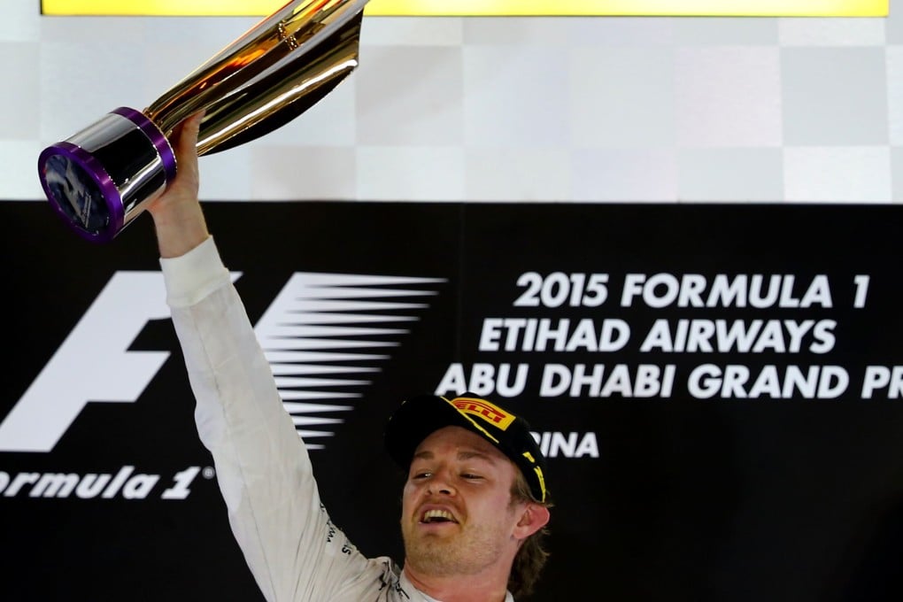 Nico Rosberg holds his trophy aloft after winning the season-ending Abu Dhabi Grand Prix. Photo: AFP