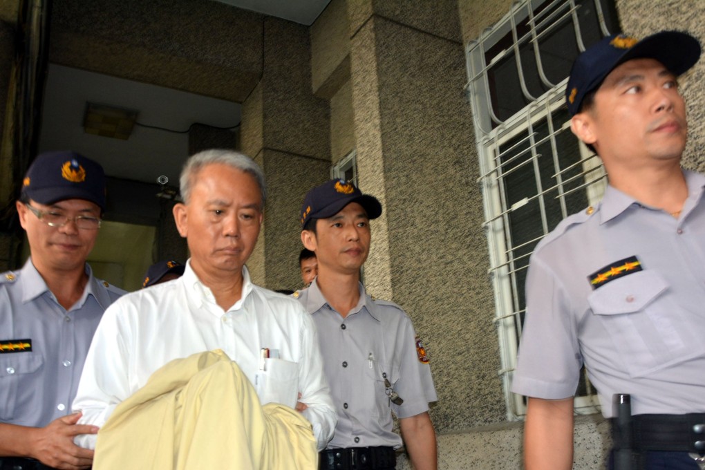 A file picture of Wei Ying-chung of Ting Hsini Group escorted to court.