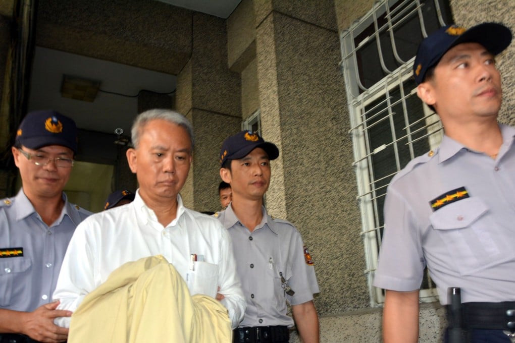 A file picture of Wei Ying-chung of Ting Hsini Group escorted to court.