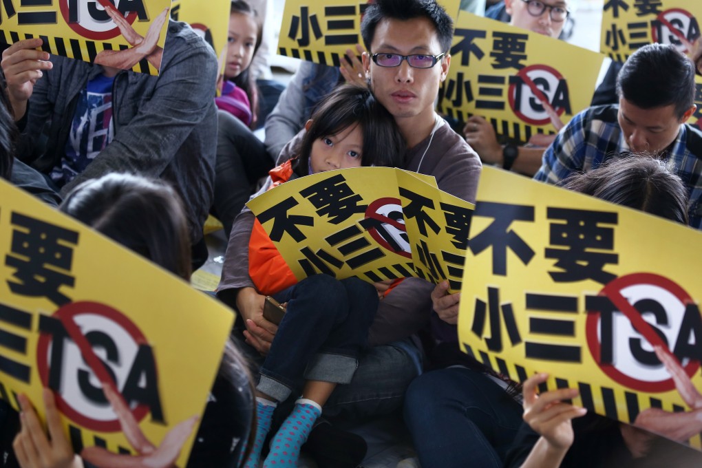 Concern Group and parents hold placards and protest against Territory-wide System Assessment (TSA) Outside Legco Building in Tamar on Saturday. Photo: Jonathan Wong