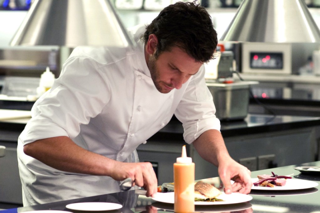 Bradley Cooper prepares dishes in the film Burnt.
