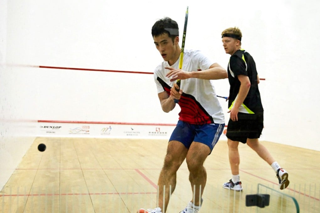 Local player Yip Tsz-fung (left) wins his Hong Kong Open first round match against England's Tom Richards. Photo: Hong Kong Squash