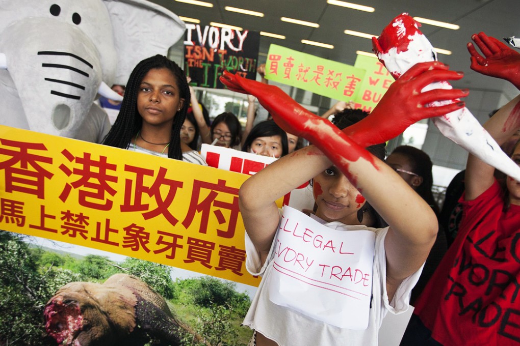 Protesters make their views known outside the Legislative Council. Photo: EPA