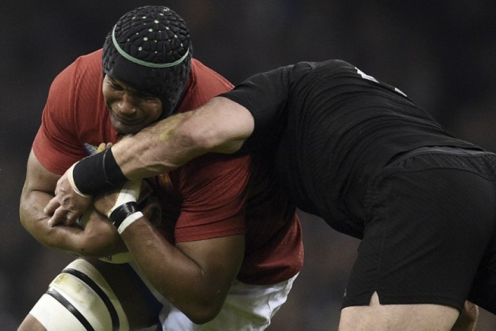 France’s flanker and captain Thierry Dusautoir runs into the New Zealand defence during their quarter-final match at the 2015 Rugby World Cup in October. Photo: AFP