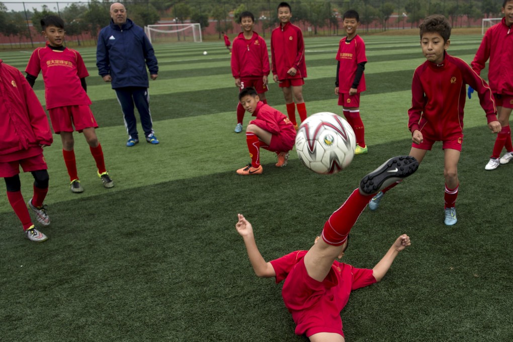 Training at Guangzhou Evergrande's soccer academy. Photo: Reuters