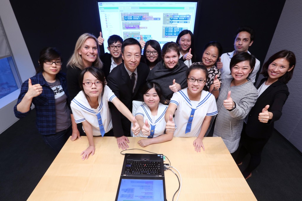Emily Hung (front, centre) and friends with (back) Credit Suisse IT staff, Nickey Khemchandani, and (centre) instructor Gabo Tse; Liza Green, vice-president corporate citizenship; Peter Mo; Lisa Moore; Nicole Yuen, head of China equities; and managers Connie Cheung and Sarah Cheong.Photo: Edward Wong