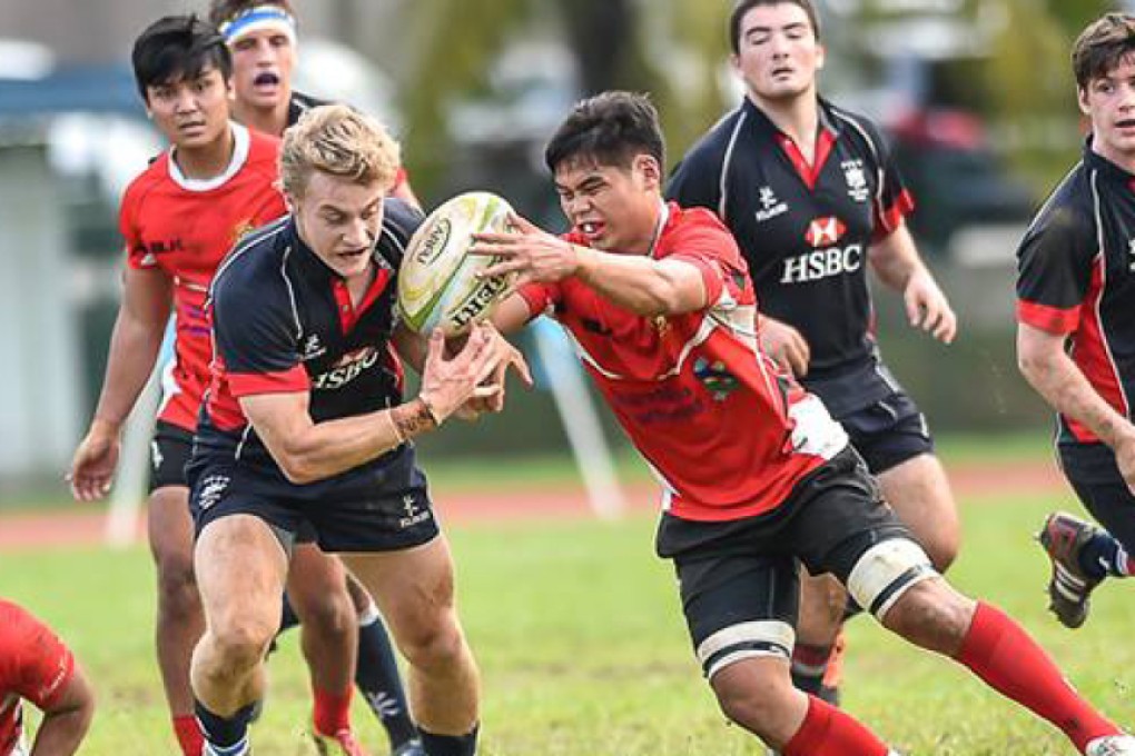 Matt Worley (left) opened the scoring against Singapore when he ran in the first of nine Hong Kong tries on Saturday. Photos: HKRU