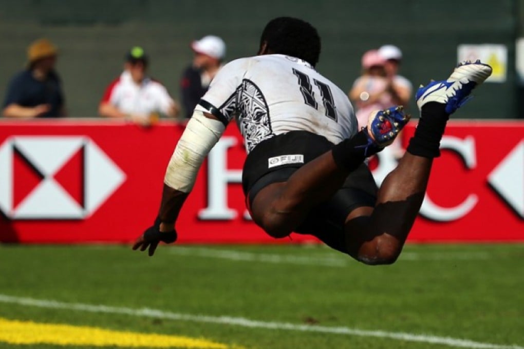 Fiji’s Savenaca Rawaca appears to fly over the paint as he scores a try against Japan during December’s Dubai Sevens – the first stop on the 2015-16 World Rugby HSBC Sevens Series tour. Photo: AFP