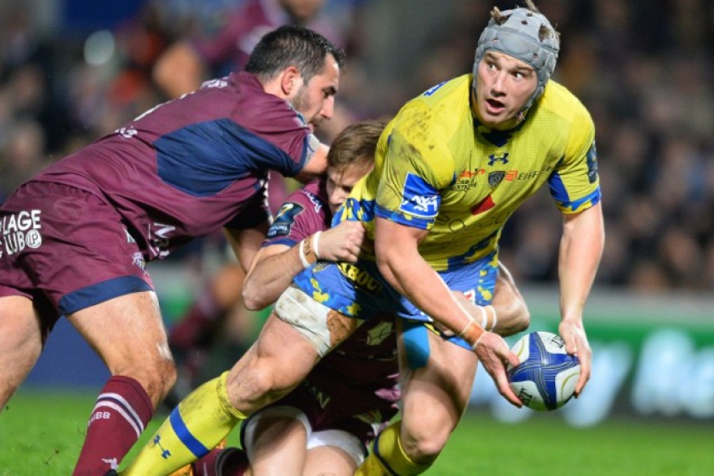 Clermont’s Welsh centre Jonathan Davies prepares to offloads as he is tackled during a European Rugby Champions Cup pool clash against Bordeaux-Bègles at the Stade Jacques-Chaban-Delmas in Bordeaux on Friday. Photos: AFP