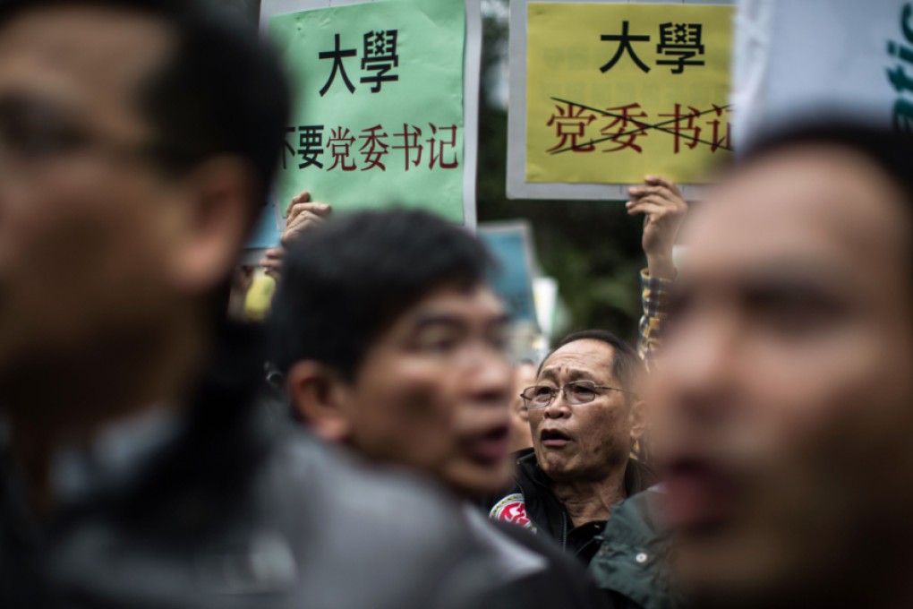 Protesters shout slogans during a rally in Hong Kong against Executive Council member Arthur Li's selection last month as chairman of Hong Kong University's governing council. Photo: AFP