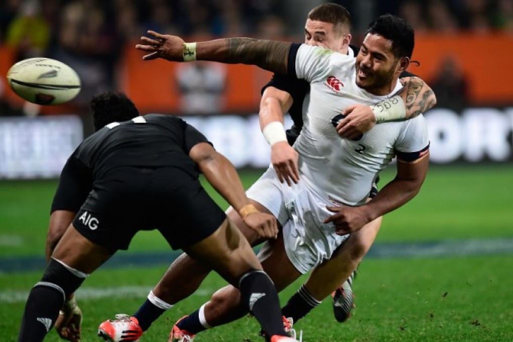 England’s Manu Tuilagi offloads as he is tackled during a match against New Zealand. If he can stay fit, the powerhouse inside centre is expected to figure heavily in Eddie Jones’ plans for the Six Nations. Photos: AFP