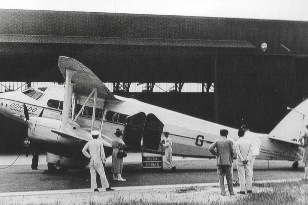 A 10-seat, four-engine de Havilland 86  at Kai Tak airport after completing the first flight by Imperial Airways to Hong Kong in 1936.  British Airways is celebrating the anniversary of the flight this year.