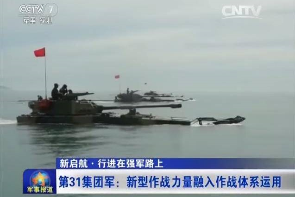 State television broadcast images of amphibious armoured vehicles ploughing through the sea towards a landing site. File Photo