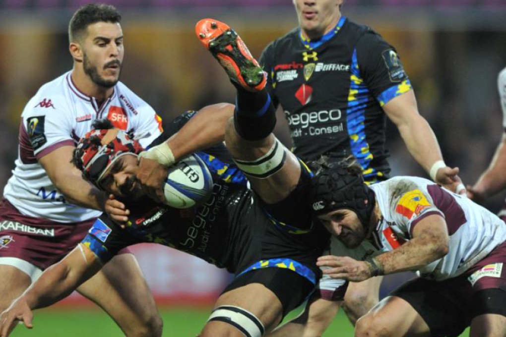 Clermont flanker Fritz Lee is tackled by the Bordeaux-Bègles defence during their European Rugby Champions Cup clash at Stade Michelin in Clermont-Ferrand on Sunday. Photo: AFP