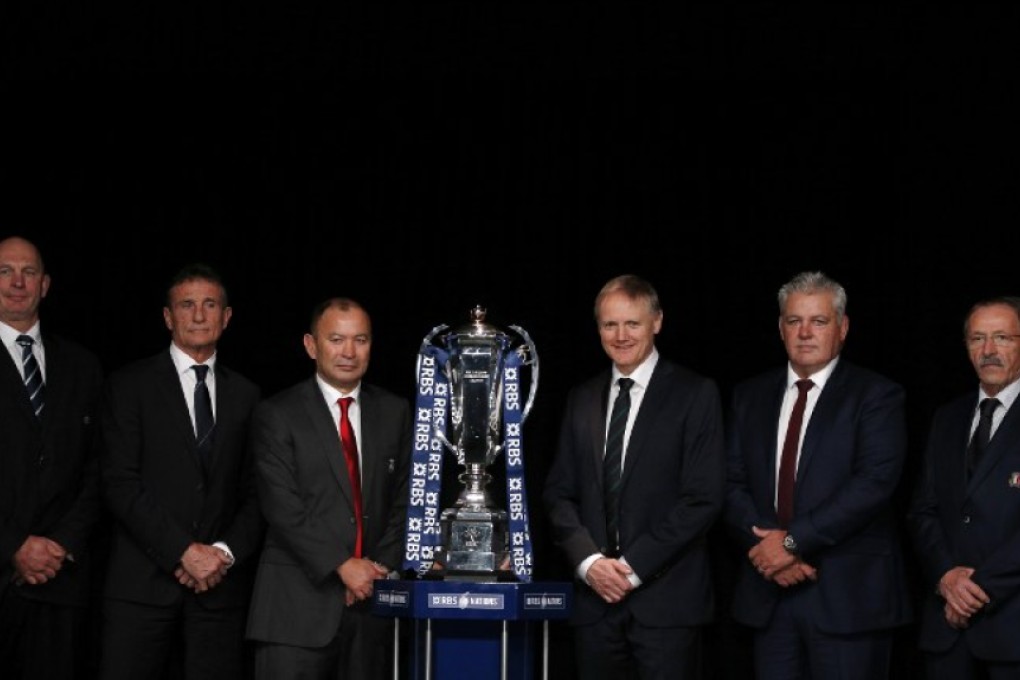 International rugby coaches (from left) Scotland’s Vern Cotter, France’s Guy Noves, England’s Eddie Jones, Ireland’s Joe Schmidt, Wales’ Warren Gatland and Italy’s Jacques Brunel pose for a photograph with the trophy at the official launch of the 2016 Six Nations Championship the Hurlingham Club in London on Wednesday. Photos: AFP