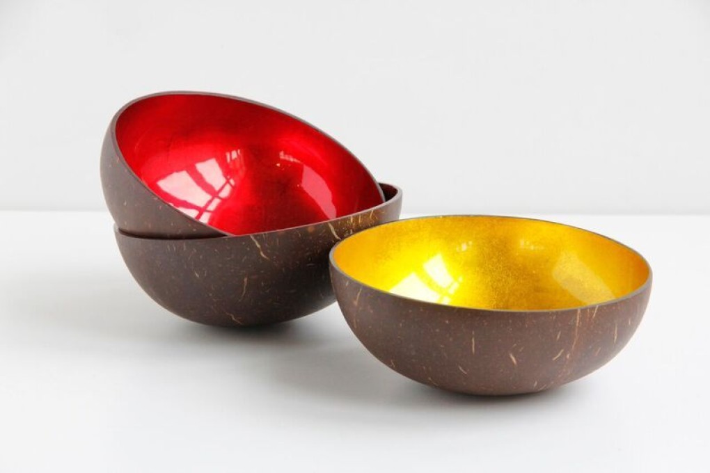 Handcrafted coconut shell bowls from TREE are inlaid with firey colours of red or gold leaf.