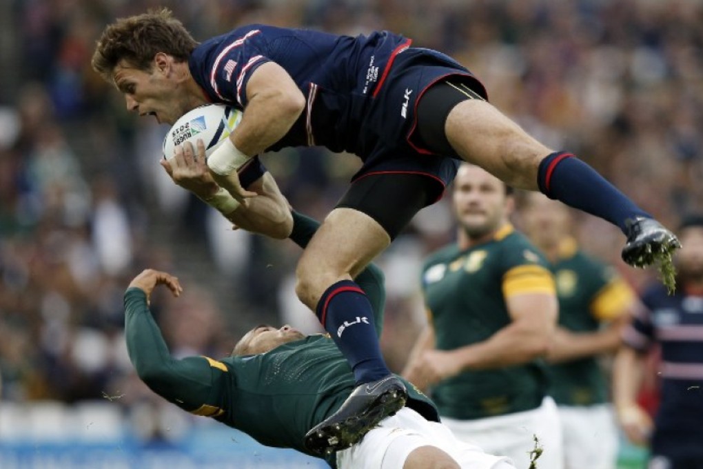 Blaine Scully, starting fullback for the US Eagles’ Americas Rugby Championship opener against Argentina on Saturday, gets up and over Bryan Habana of the Springboks at the 2015 Rugby World Cup. Photo: AFP