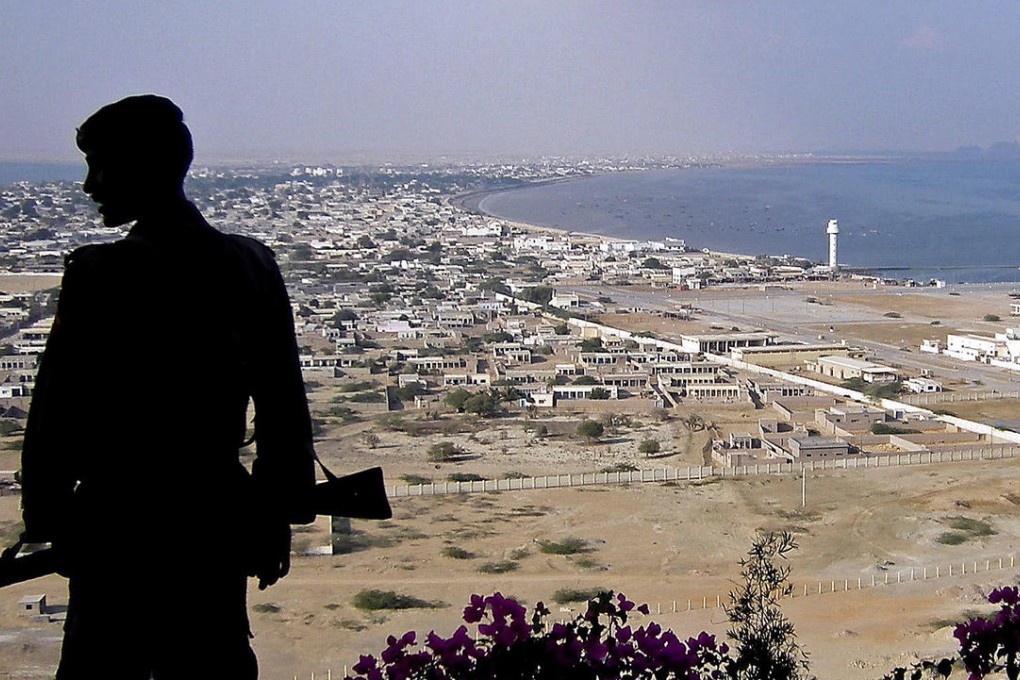 A Pakistani paramilitary soldier stands guard near where the Beijing-funded megaport of Gwadar, in southwestern Pakistan, will be built. Photos: AFP; Corbis; Imaginechina; Reuters