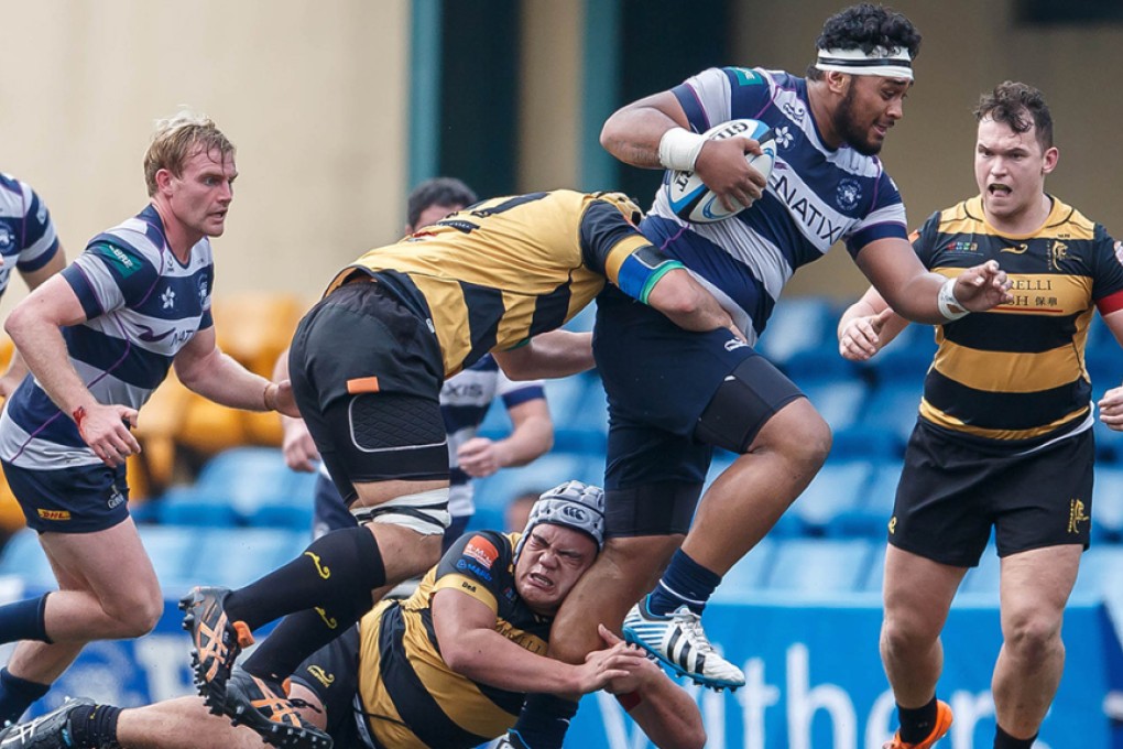 HKFC prop Matt Onesemo breaks a USRC Tigers tackle en route to scoring his side’s ninth try in a crushing 57-7 win at Sports Road on Saturday. Photos: HKRU