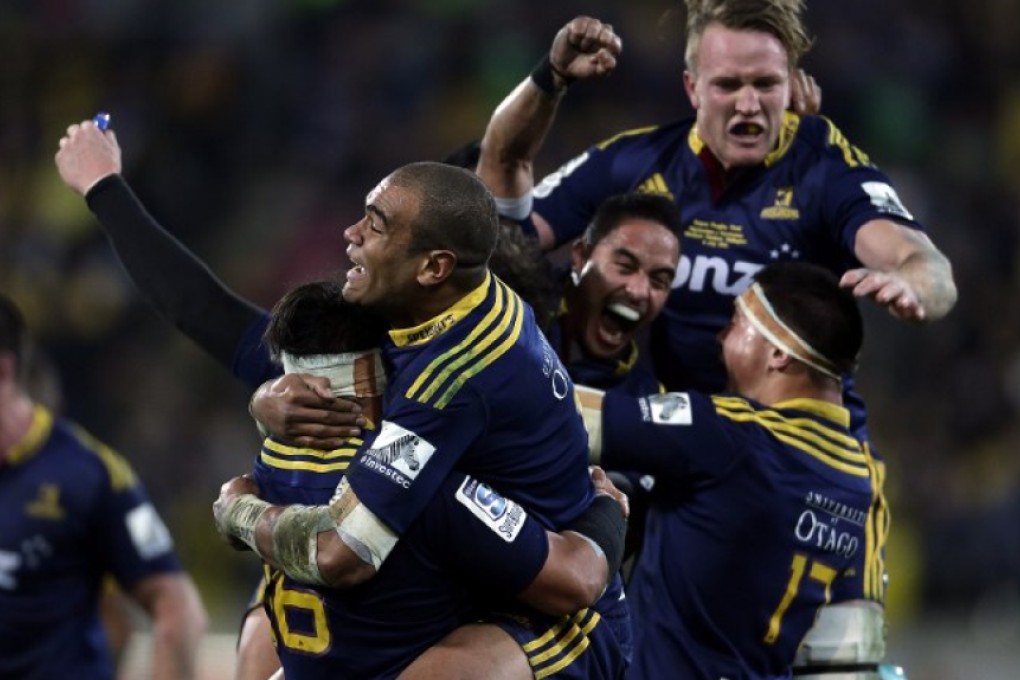Highlanders players celebrate victory over fellow-Kiwi outfit Hurricanes in the final of the 2015 Super Rugby competition at Westpac Stadium in Wellington last July. Photo: AFP