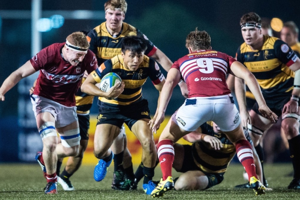 Winger Eric Kwok Pak-nga (centre) and his USRC Tigers team-mates are hoping to reverse last weekend’s defeat by HK Scottish when the two teams meet again in Saturday’s first round of the Grand Championship. Photo: HKRU