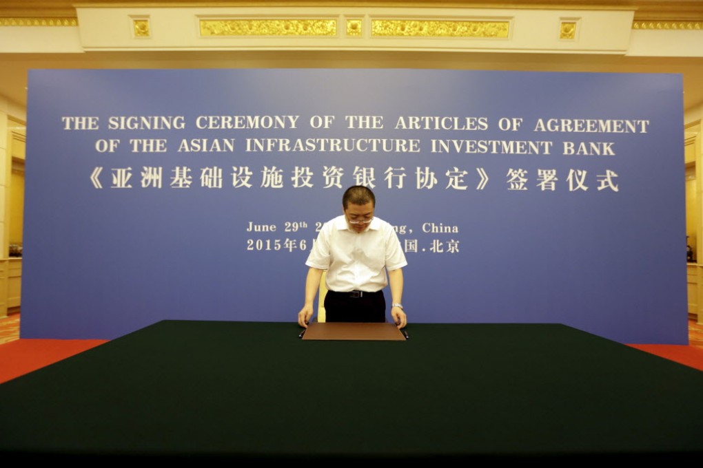 An officer from Chinese Finance Ministry prepares for a signing ceremony of articles of agreement of the Asian Infrastructure Investment Bank, at the Great Hall of the People in Beijing. Photo: Reuters