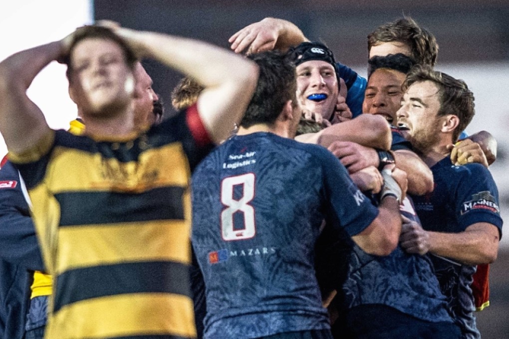 HK Scottish players celebrate their 23-20 extra-time win over USRC Tigers in the Grand Championship quarter-finals on Saturday. Photo: HKRU