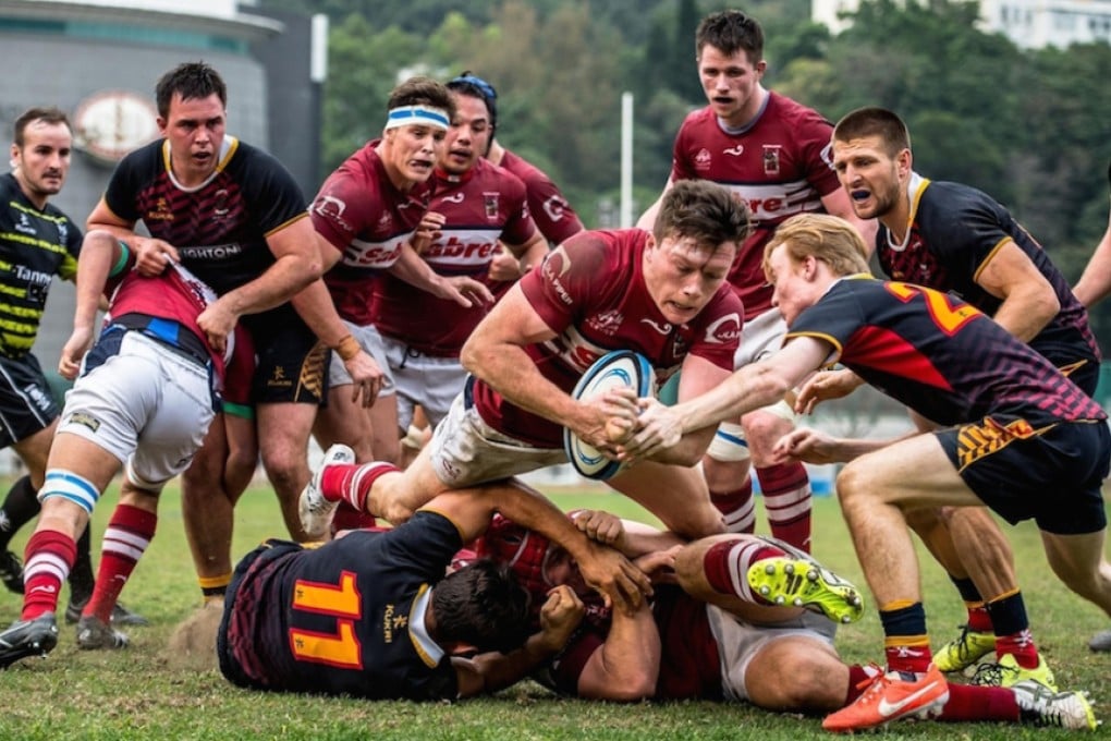 Kowloon fly-half Jack Neville dives over to score a try and hand his side a late lead in their losing semi-final clash with HKCC in the Grand Championship play-offs on Saturday. Photos: HKRU