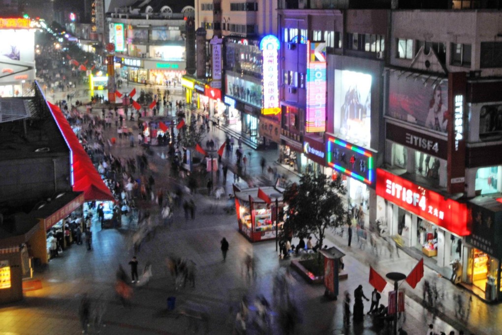 Night view of a shopping street in Zhengzhou.Photo: ImagineChina