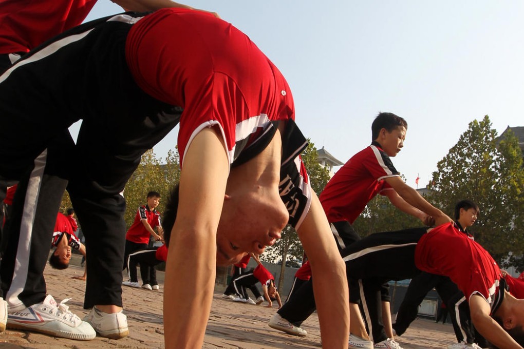 Students work out at Tagou Wushu Academy in Zhengzhou. Photo: ImagineChina