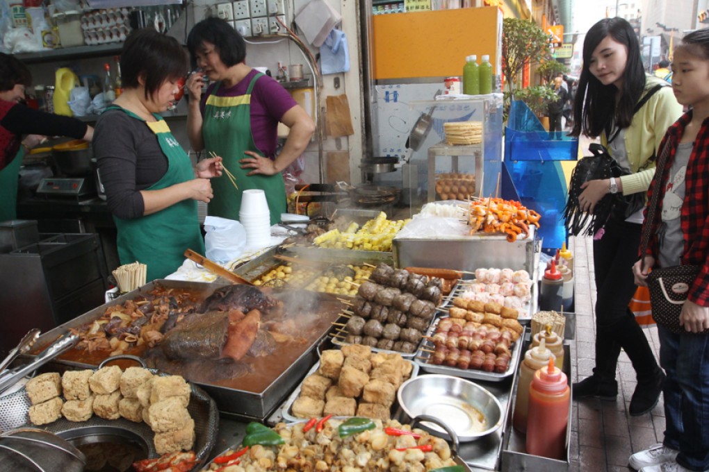 Customers buy fishballs in a snack shop at the junction of Argyle Street and Portland Street, Mongkok. Photo: Edward Wong