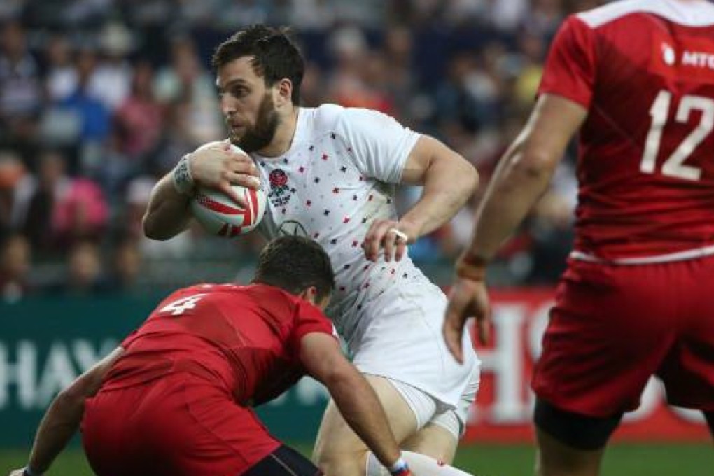 England's Charlie Hayter tries to force his way through the Russian defence. Photo: Jonathan Wong/SCMP
