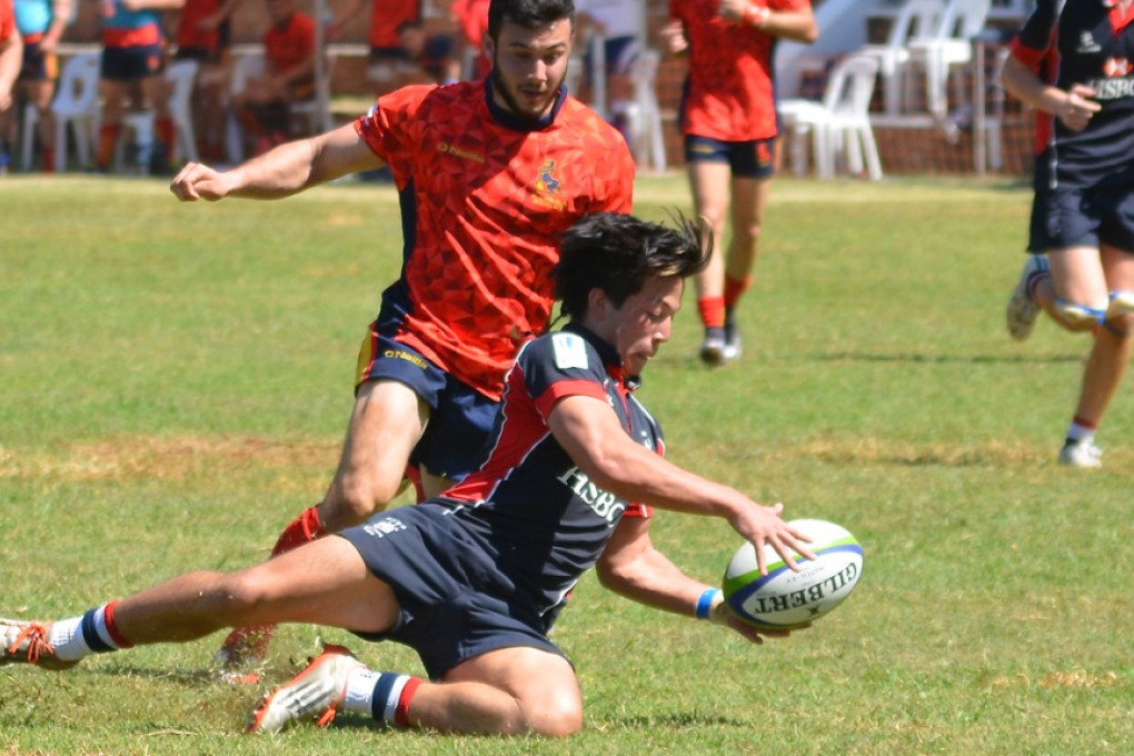 Hong Kong’s James Christie scrambles for the loose ball in a losing effort against Spain in the World Rugby U20 Trophy in Zimbabwe on Tuesday. Photos: HKRU
