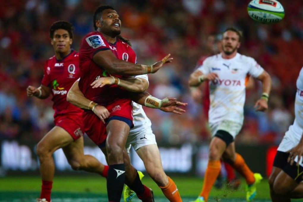 Samu Kerevi of the Queensland Reds gets a pass away against South Africa’s Cheetahs during their Super Rugby match in Brisbane on Saturday. Photo: AFP
