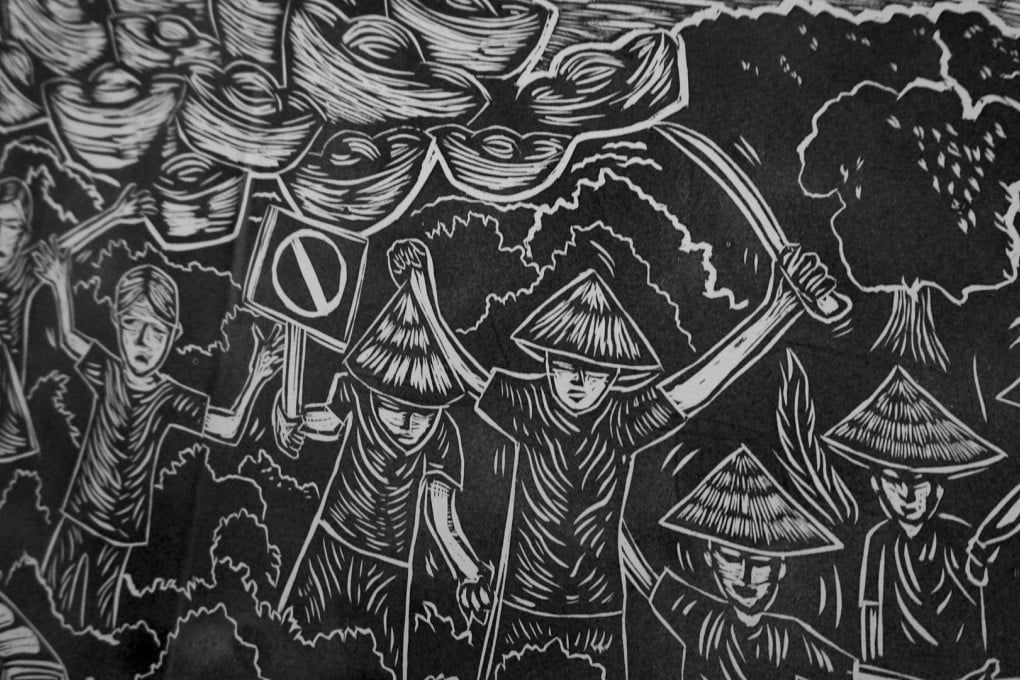 A woodcut print work by Pangrok Sulap depicts a protest against the Mamut Copper Mine work is political in nature. Photos: Nathan Thompson