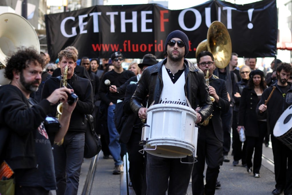 Unidentified Protesters march against the use of fluoride in drinking water in San Francisco. The Marchers believe that fluoride causes health problems.