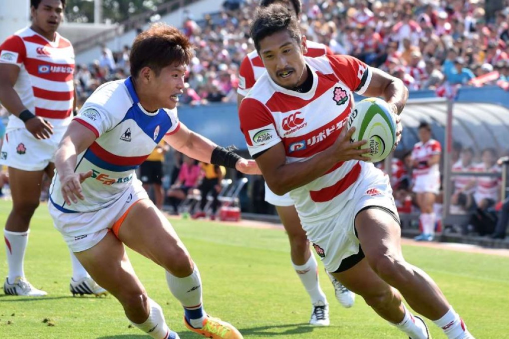Japan captain and scrum-half Keisuke Uchida runs in one of his side's 13 tries in an 85-0 romp over South Korea in the 2016 ARC opener last weekend. Photo: AFP