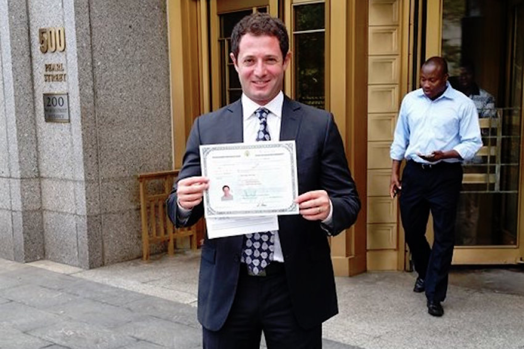 YouVisit co-founder Taher Baderkhan proudly displays his US citizenship on the day he became a citizen. Photo: Taher Baderkhan