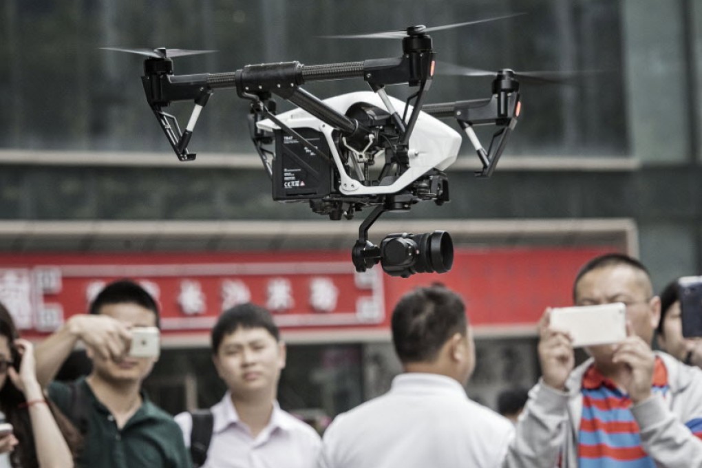 The world's largest drone maker, DJI, demonstrates its DJI Inspire 1 Pro model in its home city, Shenzhen, as the company innovates new technology and broadens export markets for commercial unmanned aerial vehicles. Photo: Bloomberg