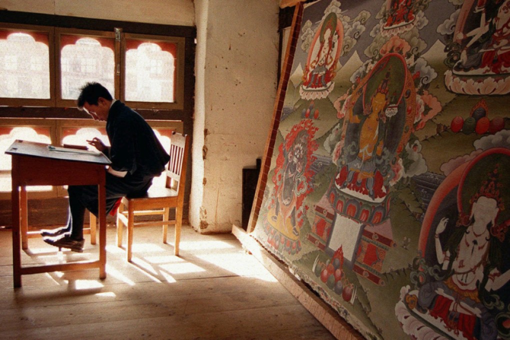 A thangka painting depicting scenes and symbols from the life of Buddha. Photo: AP